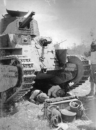 Japanese tankers resting under their Type 89 I-Go medium tank, date unknown