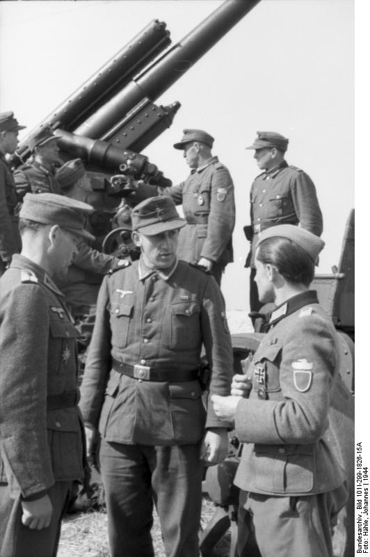 Officer and crew of a large caliber German gun, northern France, 1944