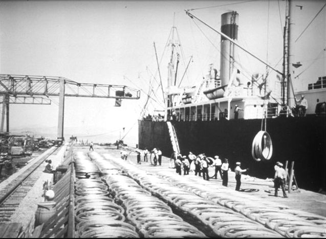 Coils of steel cables being unloaded at the Tiburon Naval Net Depot, Tiburon, California, United States, 1940s.