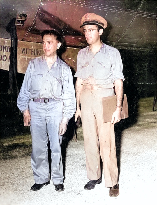 New York Times reporter William Laurence and Army information officer Major George Monyhan in front of a B-29 bomber on Tinian, Mariana Islands, 9 Aug 1945. [Colorized by WW2DB]