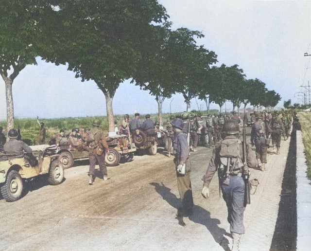 US troops marching along Highway 6 toward Rome, Italy, Jun 1944 [Colorized by WW2DB]