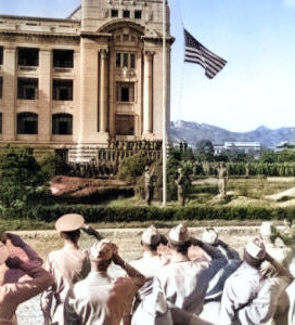 US flag being raised during the surrender ceremony at the General Government Building, Seoul, Korea, 9 Sep 1945 [Colorized by WW2DB]