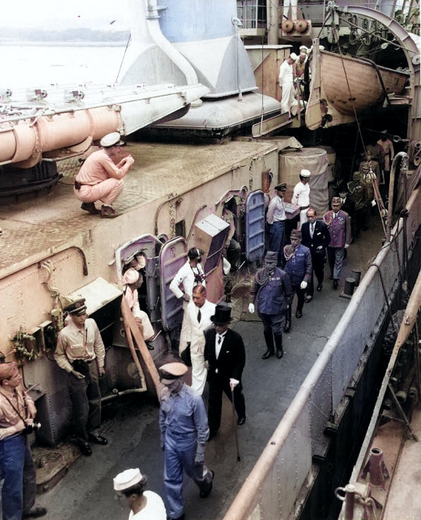 Foreign Minister Mamoru Shigemitsu and General Yoshijiro Umezu led along the deck of destroyer Lansdowne by US Army Colonel Sidney Mashbir after the surrender ceremonies, 2 Sep 1945 [Colorized by WW2DB]