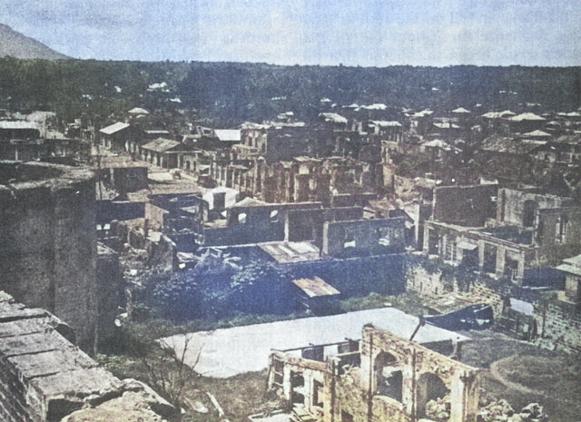 Destroyed buildings of Lipa City, Luzon, Philippine Islands, after 29 Mar 1945 [Colorized by WW2DB]