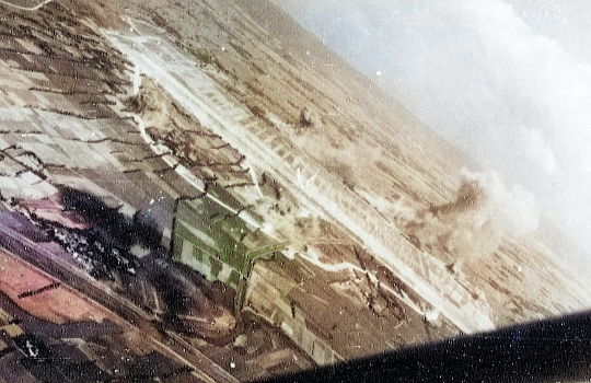 Shoka Airfield in Shoka (now Changhua), Taiwan under US Navy carrier aircraft attack, 12 Oct 1944, photo 2 of 2 [Colorized by WW2DB]