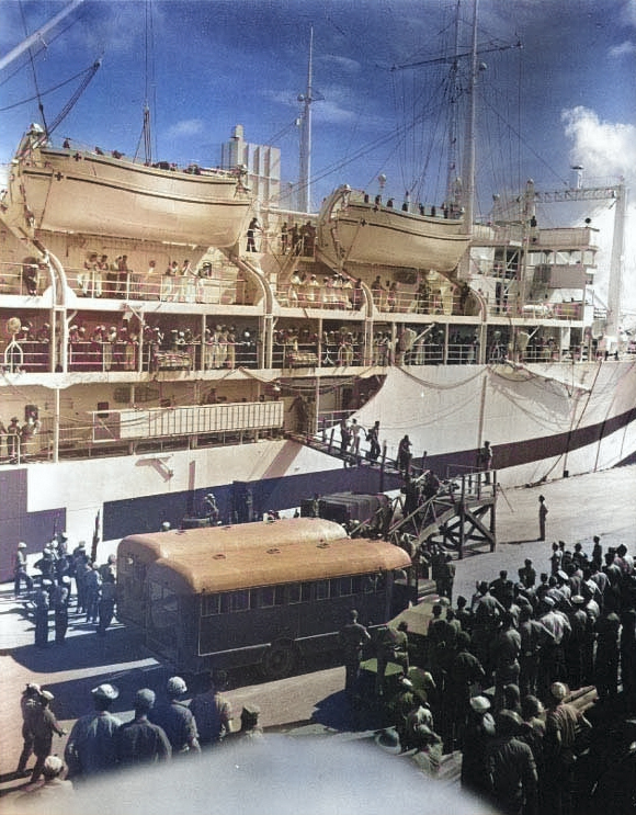 Hospital ship Tranquillity arrived at Guam with survivors of Indianapolis, 8 Aug 1945, photo 3 of 3 [Colorized by WW2DB]