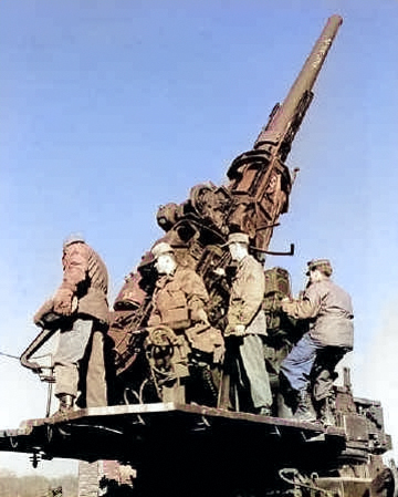 120 mm Gun M1 anti-aircraft weapon manned by men of Battery D, US 36th Anti-aircraft Artillery Gun Battalion during training, Fort George G. Meade, Odenton, Maryland, United States, Feb 1953 [Colorized by WW2DB]