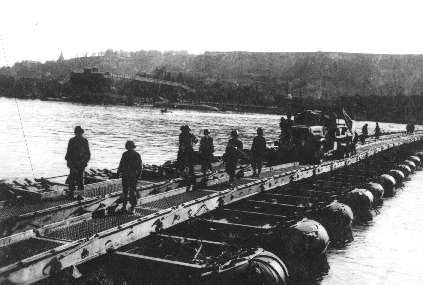 Men of B Company of US 150th Combat Engineer Battalion building the first bridge across the Rhine River, Germany, 23 Mar 1945