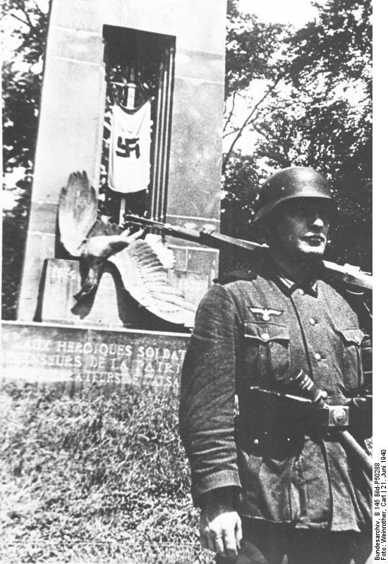 German soldier standing next to the memorial of the French victory over Germany in 1918, Compiègne, France, 22 Jun 1940