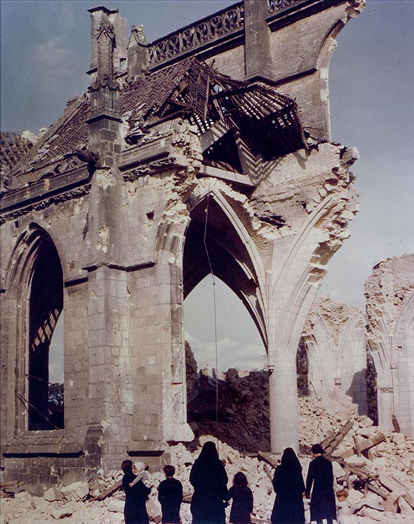 Two Nuns and a French family examined the ruins of the bombed Église Saint-Malo, Valognes, France, Jul 1944