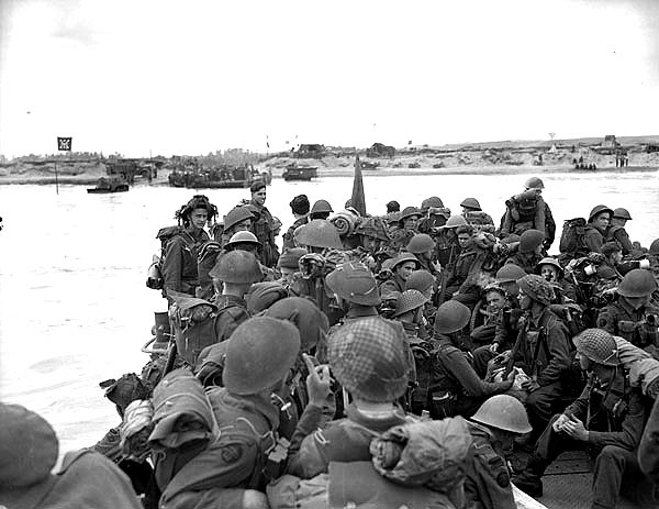 Men of Royal Canadian Navy Beach Commando 'W' landing on Mike Beach, Juno Beach, Normandy, 6 Jun 1944