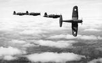 Four F4U Corsair fighters practicing aerial maneuvers, Mar-May 1943; probably stateside training. Photo 2 of 2.