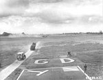 B-26C Marauder “Carefree Carolyn” of the 552nd Bomb Squadron makes a wheels-up landing after having her hydraulics shot out, RAF Great Dunmow, Essex, England, June 15 1944. Note the WC54 Ambulance and fire crews rushing to the scene. Photo 1 of 2