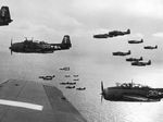 TBM Avengers and SB2C Helldivers flying from the carrier Bunker Hill, western Pacific, Feb 1945