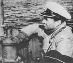 Commanding Officer Kapitänleutnant Peter Schrewe on the bridge of the German Type IXC/40 submarine U-537, Atlantic Ocean, Oct 1943.