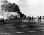 Fantail of USS Belleau Wood burning after being struck by a special attack aircraft, off the Philippine Islands, 30 Oct 1944