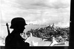 A German sentry overlooking the Pechersk Lavra Monastery and Dnieper River in Kiev, Ukraine, 20 Sep 1941.