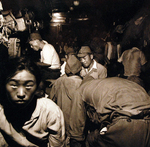 Demobilized Japanese soldiers and civilians aboard a train in Hiroshima, Japan, Sep 1945