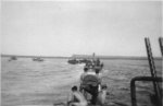 PT-114 and other PT Boats of Motor Torpedo Boat Squadron 6 (MTBRon 6) on patrol in the Solomon Islands or the New Guinea area, 1942-43. Note twin Browning M2 .50 caliber machine guns in foreground.