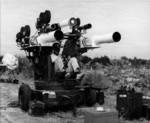 Leslie Elliott operating filming equipment mounted on a M45 Quadmount, Cape Canaveral, Florida, United States, date unknown