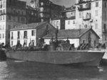PT-211, a Higgins 78-footer of Motor Torpedo Boat Squadron 15 (MTBRon 15) in Bastia harbor, Corsica, France, May 1944. Note the raised rocket launcher rails on the foredeck.