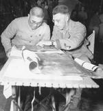 Major General Liao Yaoxiang and Lieutenant General Joseph Stillwell studying a map, Burma, Mar 1944