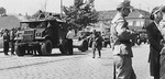 Three Canadian Chevrolet CMP 8440CGT Field Artillery Tractors pulling QF 25-pounder howitzers with limbers, probably in the South of France, late 1944.