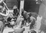 Civilians making bean meal, Okinawa, Japan, 1945