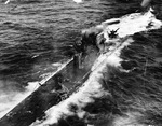 The decks and conning tower of U-175 after being forced to the surface by depth charges from Coast Guard cutter Spencer just before U-175 sank, North Atlantic, 500 nautical miles WSW of Ireland, 17 Apr 1943.
