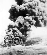 United States Army A-20 Havoc on a bombing raid against the oil storage facilities at Boela (now Bula) on Serem Island west of New Guinea in the Dutch East Indies, fall 1944.