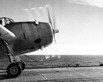 TBF Avenger running up its engines before launching from escort carrier USS Santee in the Atlantic, Nov 1943. Note the catapult bridle attached to the landing gear.