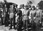 Chiang Kaishek and Song Meiling, accompanied by US and Chinese officers, inspecting the Ramgarh Training Center, India, 1940s
