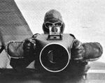 United States Army Captain Robert Smith of the Alaskan Survey in Jun 1931 holding a Fairchild F-8 aerial camera, predecessor to the K-20 model used in WWII.