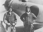 Japanese pilots Masao Asai and Masao Sato aboard carrier Akagi in the East China Sea, 1938-1939; note A5M fighter in background