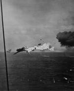 A B6N2 torpedo bomber exploding in mid-air after direct hit by 5-inch shell from carrier Yorktown, off Kwajalein, Marshall Islands, 4 Dec 1943