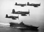 F4U-4 Corsair fighters of US Navy squadron VF-884 flying above USS Boxer, off Korea, 4 Sep 1951