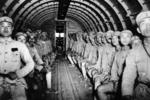 Chinese troops in the interior of a C-47 Skytrain aircraft, in flight from China to India, circa 1944-1945