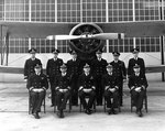 Rear Admiral Charles A. Blakeley of US Navy Carrier Division Two and his staff posed before SOC Seagull aircraft, Naval Air Station, Norfolk, Virginia, United States, 14 Jan 1938