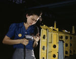 A female Vultee Aircraft Corporation employee working on the horizontal stabilizer for a Vengeance dive bomber, Nashville, Tennessee, United States, Feb 1943