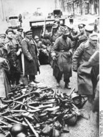 German troops surrendering their weapons near a subway entrance, Berlin, Germany, 2 May 1945