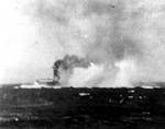 Lexington under dive bomber attack during Battle of Coral Sea, shortly before noon on 8 May 1942