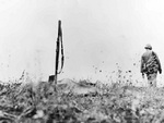 Makeshift grave of an US Marine, marked by his poncho and bayoneted rifle, Saipan, Mariana Islands, Jun-Jul 1944