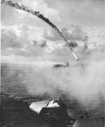 Flaming Japanese Nakajima J1N1 Gekkō "Irving" plunging toward the sea near the Marianas Islands as seen from escort carrier Kitkun Bay, 18 Jun 1944, photo 2 of 2.