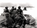 Canadian infantrymen aboard a landing craft launched from HMCS Prince Henry, off Normandy beach, France, 6 Jun 1944
