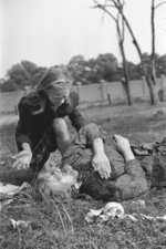 Ten-year-old Polish girl Kazimiera Mika mourning the death of her sister, caused by strafing German aircraft, near Jana Ostroroga Street, Warsaw, Poland, 13 Sep 1939, photo 1 of 2
