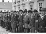 Men of the para-military Sudetendeutsche Freikorps lining up to greet Hitler who was scheduled to arrive shortly, Niemes, Sudetenland, Germany, 10 Oct 1938