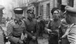 German SS-Gruppenführer Heinz Reinefarth (left, with papers) and commanding officer of 5th Regiment (Kuban Cossack Infantry) Jakub Bondarenko (next to Reinefarth) near Wolska Street during the Warsaw Uprising, Poland, Sep 1944