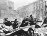 Polish resistance fighters with various small arms at the intersection of Swietokrzyska and Mazowiecka Streets, Warsaw, Poland, Aug 1944