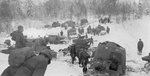 Soviet T-26 light tanks and T-20 Komsomolets armored tractors crossing the Russian border into Finland during the Winter War, 2 Dec 1939