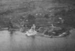 Rising Sun Petroleum Company facilities and nearby military seaplane base at Tamsui, Taiwan under attack by aircraft from USS Intrepid, 12 Oct 1944, photo 1 of 3